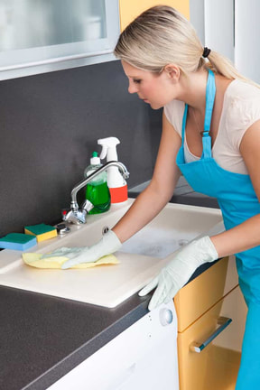 woman cleaning worktop in Peterborough Ontario