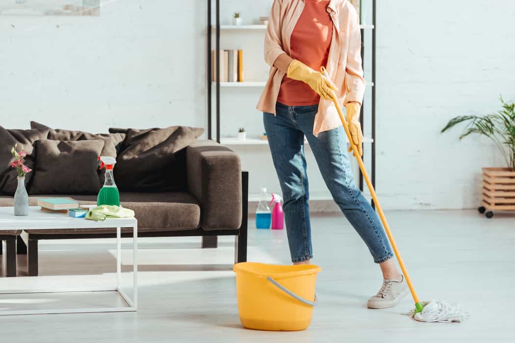 woman with mop and bucket